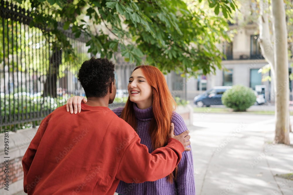 Obraz premium Two young people greeting each other outdoors after meeting through dating apps