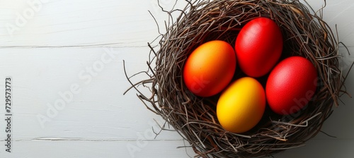 Colorful easter eggs in nest on white background, top view mockup with space for customization