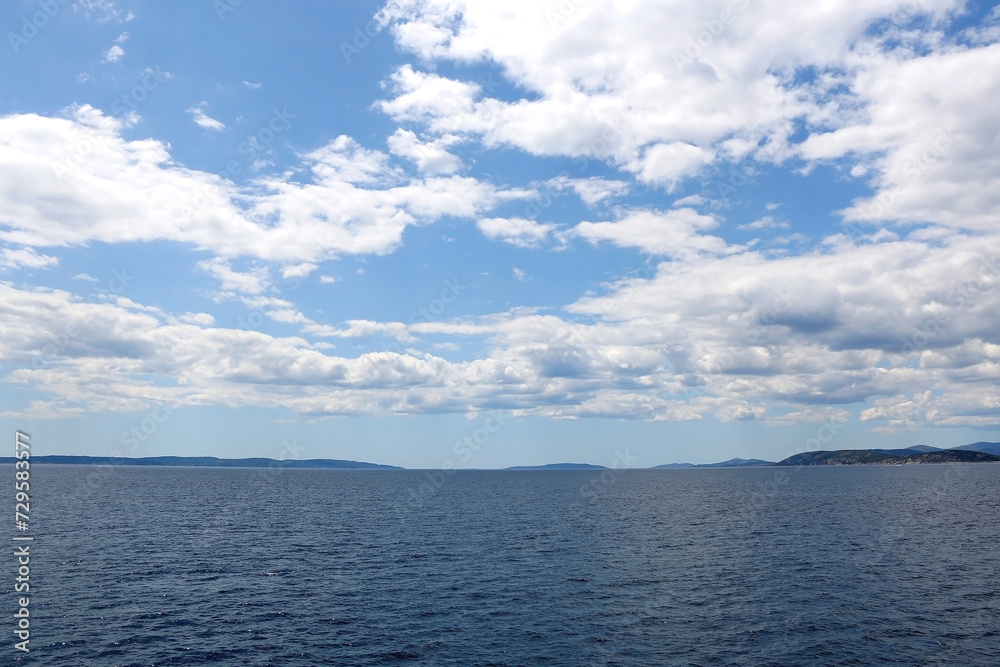 Bright blue sea and clear sky. Copy space.