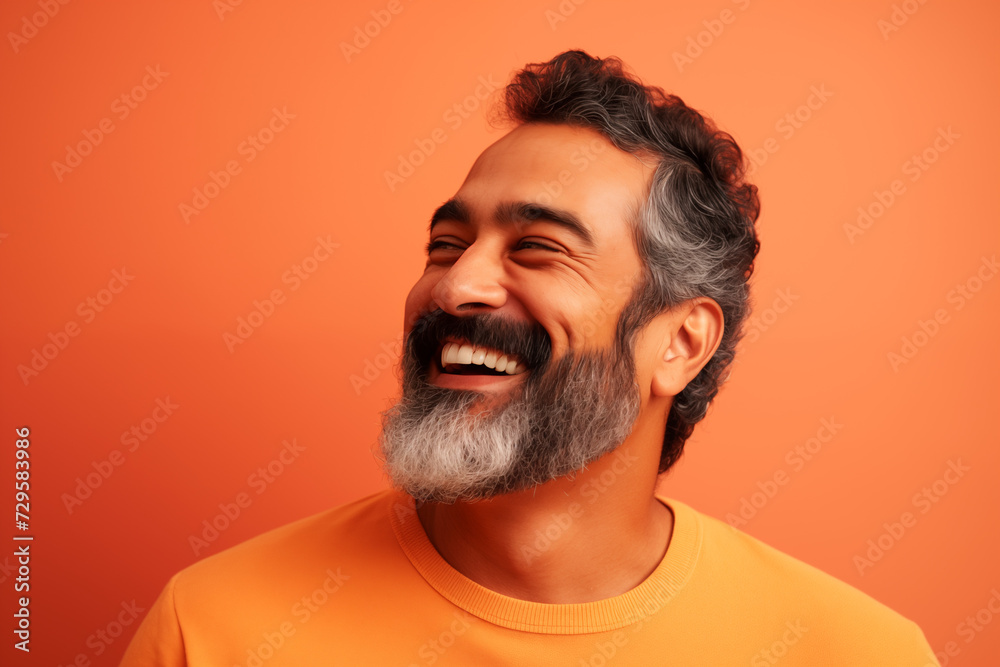 Obraz premium Candid closeup of happy diverse man with bright plain background