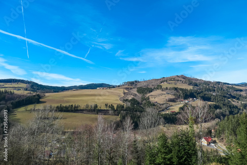 Alpine meadow in West Styrian highland in Voitsberg, Styria, Austria. Hiking in remote landscape of soft hills and forest in spring. Scenic view of idyllic mountains of Lavanttal Alps. Wanderlust photo