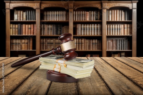 Wooden desk in courtroom, money and material concept