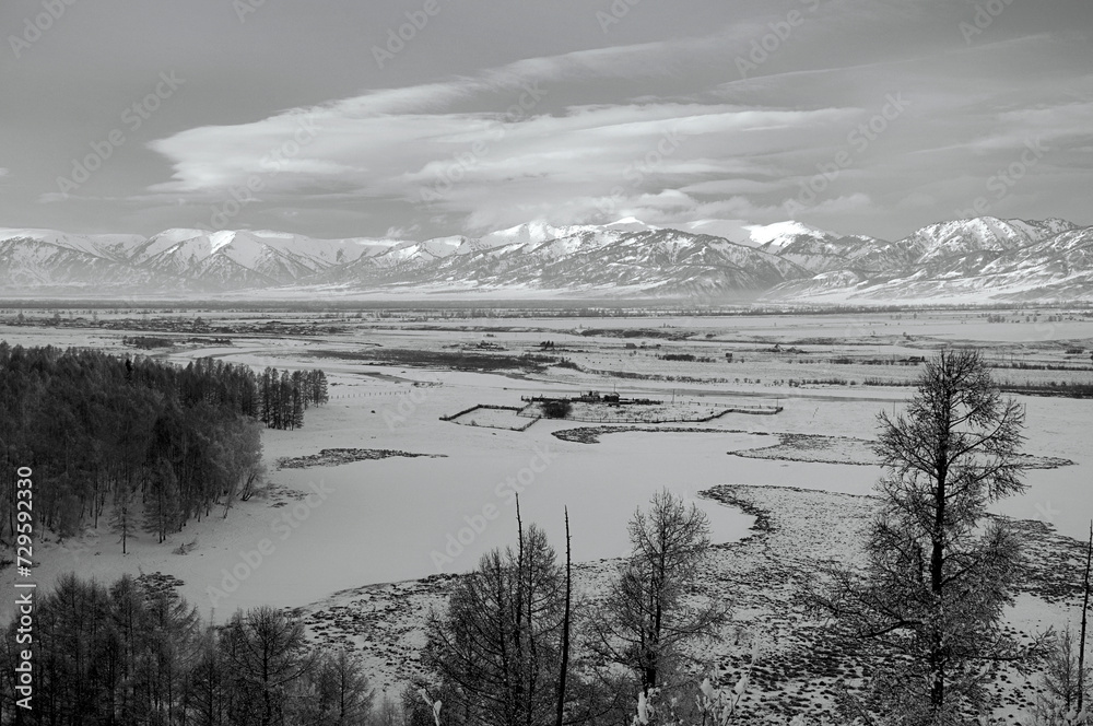 Fototapeta premium Cold snowy mountain landscape at sunset.