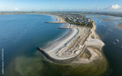 Aerial: Harbour and sandspit in Omaha Beach, Warkworth, New Zealand. photo