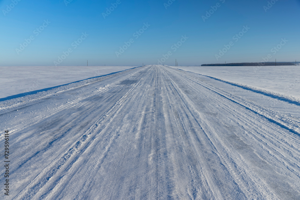a slippery and dangerous road covered with snow and ice