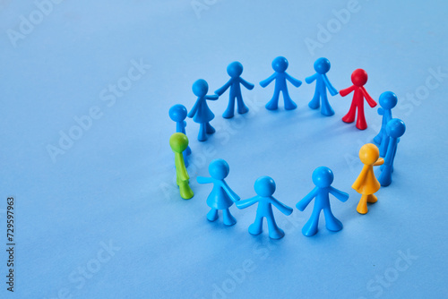 Diversity and inclusion concept. Colorful figurines on blue background