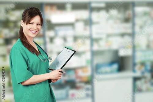 Young pharmacist working in the big drugstore