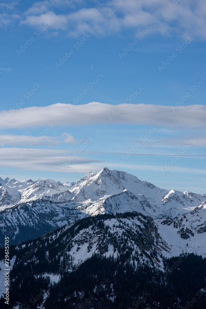Panorama of a snow covered mountain lake. Winter mountain snow lake. Lake in snowy mountains. Mountain lake in snow