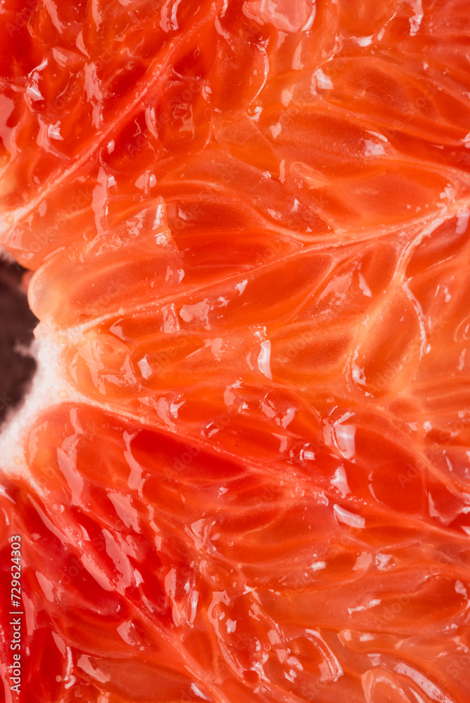 Macro photography of a grapefruit slice. Fresh fruit, pulp and peel detail Macro photography of a grapefruit slice. Fresh fruit, pulp and peel detail