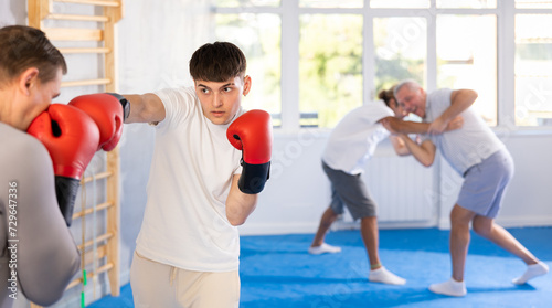 Two athlete men in sportswear practicing boxing sparring in the hall © JackF