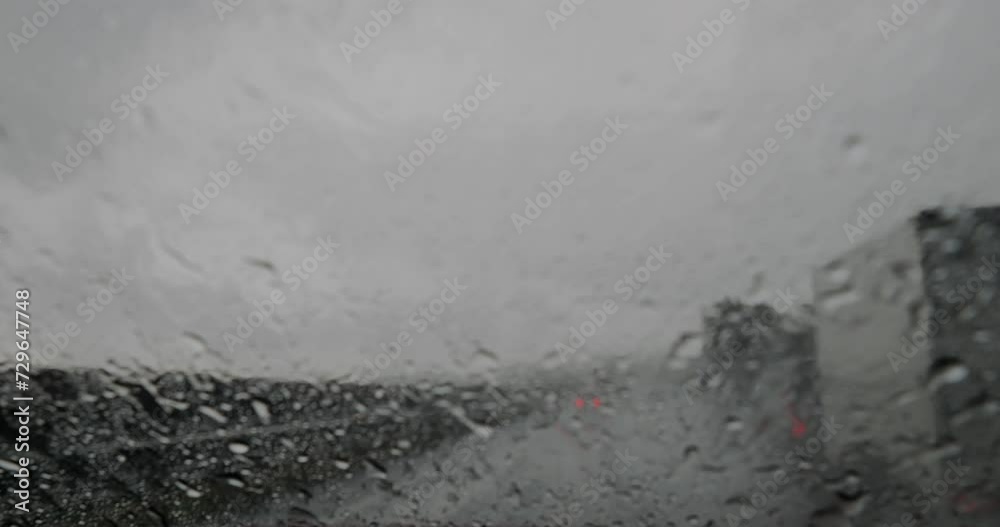 Blurred view through a car windshield in the rain Blurred view through a car windshield in the rain