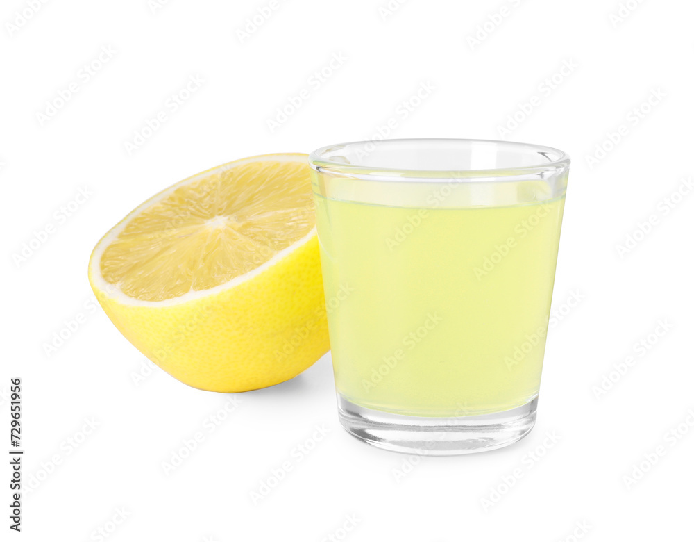 Shot glass with tasty limoncello liqueur and half of lemon isolated on white Shot glass with tasty limoncello liqueur and half of lemon isolated on white