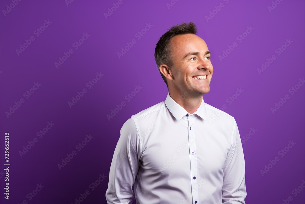 Portrait of a smiling young man on a purple background. Copy space. Portrait of a smiling young man on a purple background. Copy space.