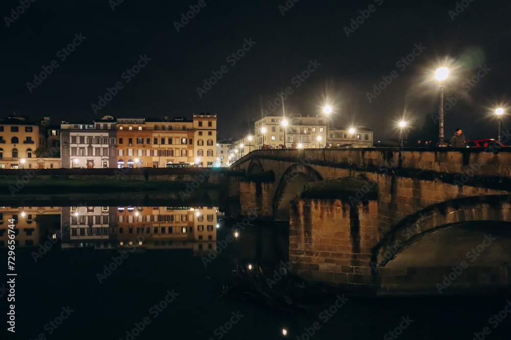 Embankment of Arno River at night, in Florence, Italy