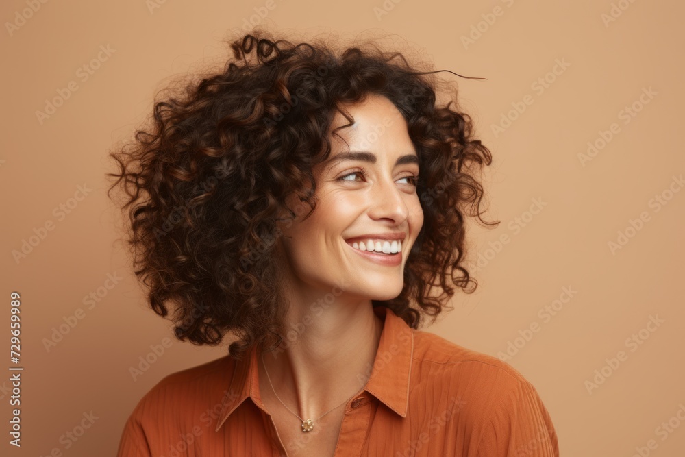 Portrait of young happy smiling woman with curly hair looking up. Portrait of young happy smiling woman with curly hair looking up.