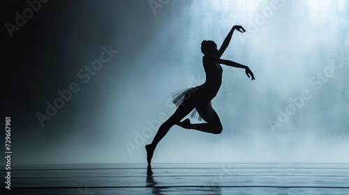  a silhouette of a ballerina dancing in front of a waterfall with her arms in the air and her leg in the air, with her right leg in the air.