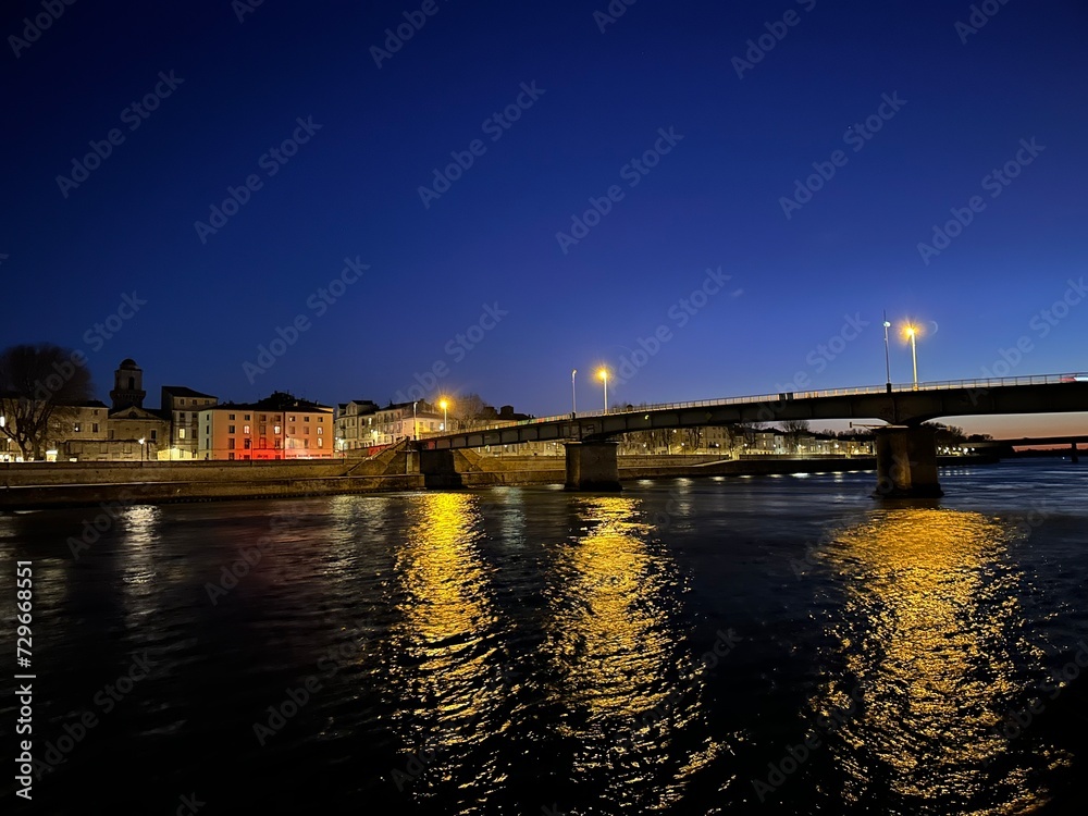 Night view of the bridge over the river Rhône in Arles, Provence-Alpes-Côte d'Azur, France, February 2023