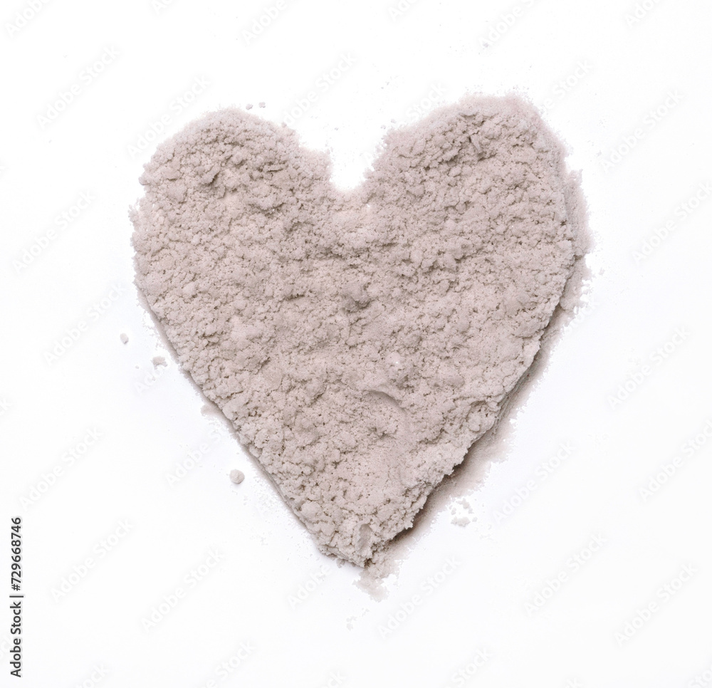 Fototapeta premium Sandy Heart. Love Symbol made of Fine Sand. White Background. No text. Sunny Beach Sand Arranged in the Shape of a Heart. Summer Love.