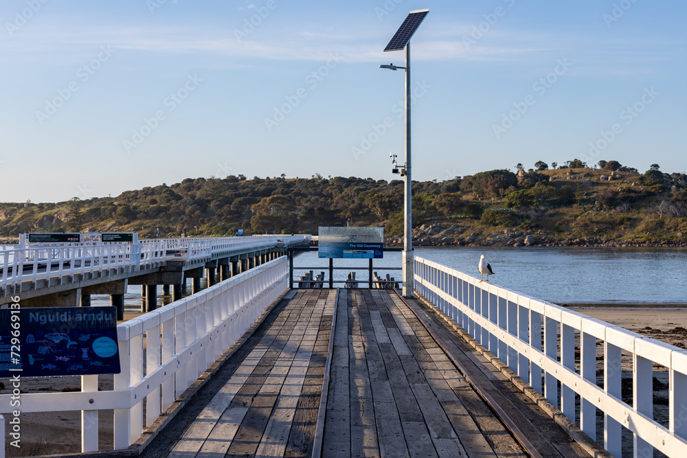 The old and new causeway between Victor Harbor and Granite island on a bright sunny day in South Australia on September 11th 2023