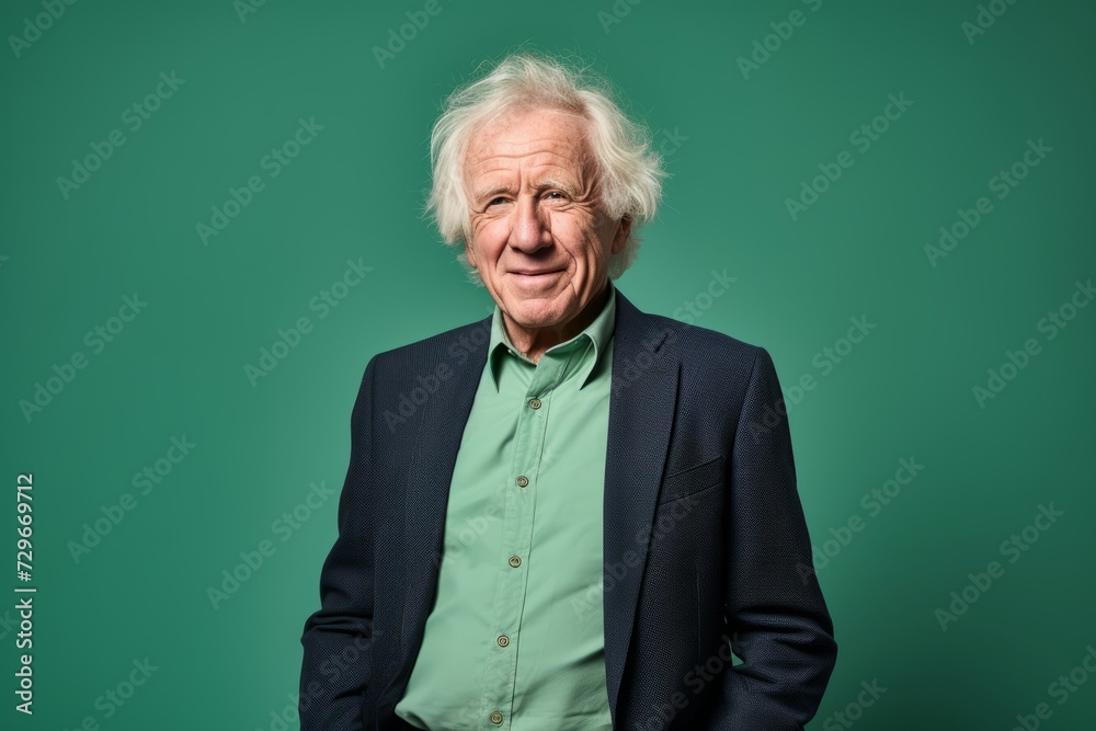 Portrait of a senior man on a green background. Studio shot. Portrait of a senior man on a green background. Studio shot.