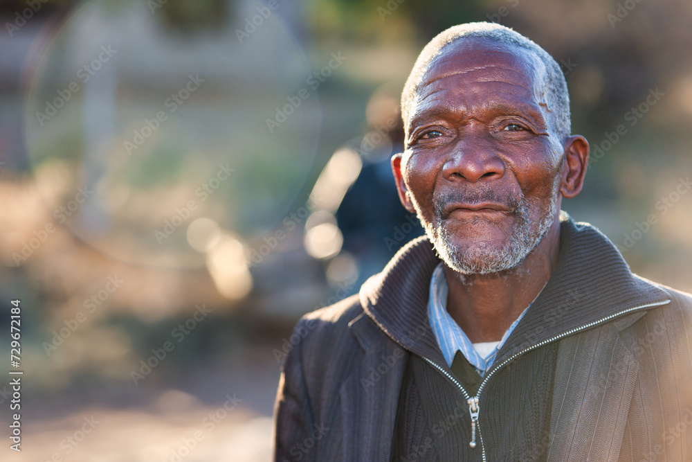 village old african man standing outdoors in a sunny day village old african man standing outdoors in a sunny day