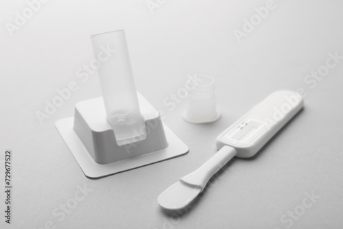 Disposable express test kit on light grey background