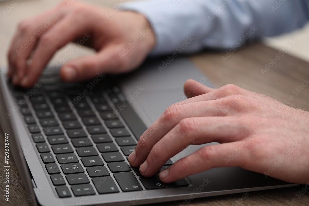E-learning. Man using laptop during online lesson at table indoors, closeup E-learning. Man using laptop during online lesson at table indoors, closeup