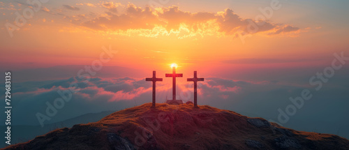 Christian Easter concept. Resurrection of Jesus Christ. Silhouette of three crosses on mountain summit.