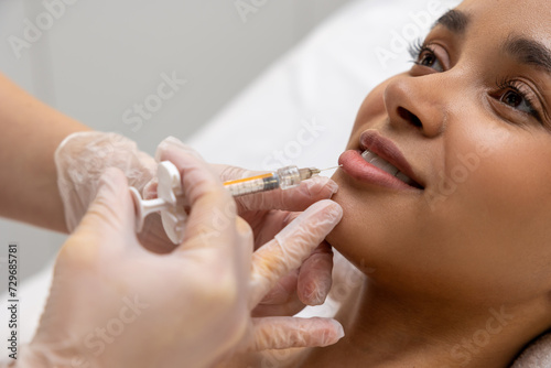 Smiling woman on a mesotherapy treatment session