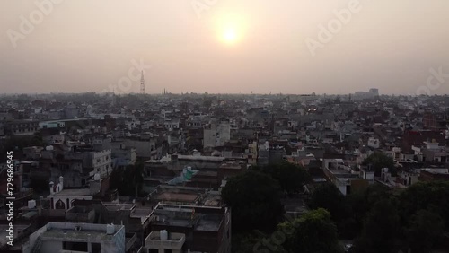 Drone video over buildings in the city of Ludhiana, India at sunset