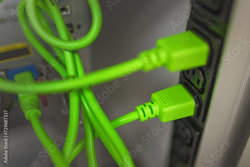 Plugged IEC 60320 C14 power cables to IEC 60320 C13 sockets in a server rack.