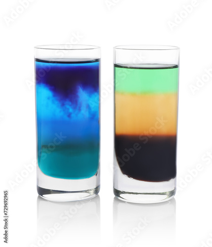 Two shooters in shot glasses isolated on white