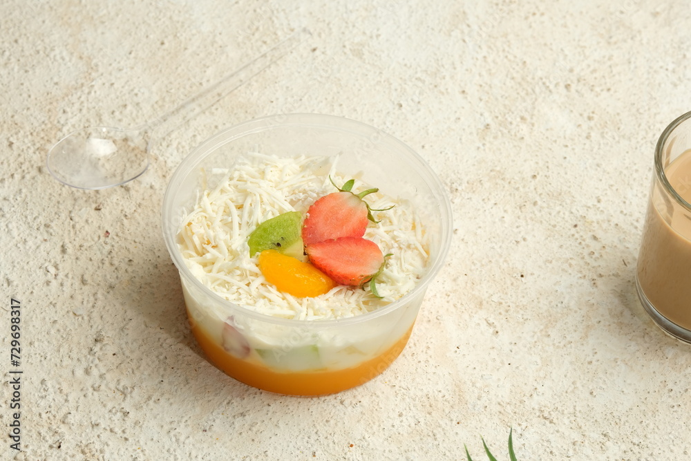 Bowl of Healthy Fresh Fruit Salad or Salad Buah on White Background Bowl of Healthy Fresh Fruit Salad or Salad Buah on White Background