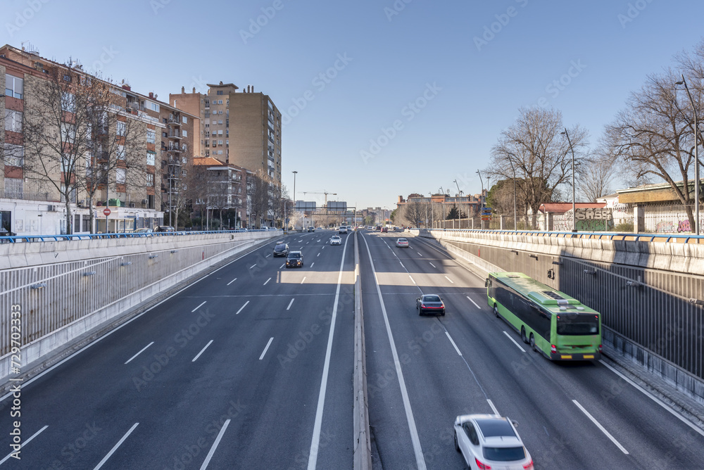 Road traffic at the exit of a tunnel on a highway exiting the city of Madrid