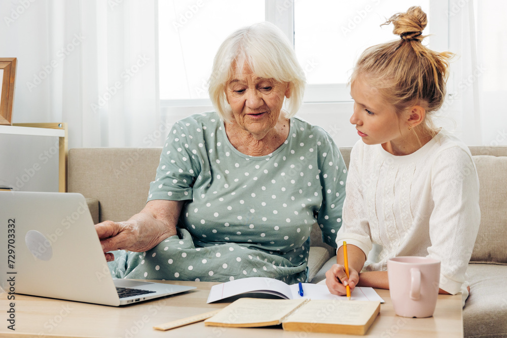 Child family grandmother laptop hugging Child family grandmother laptop hugging