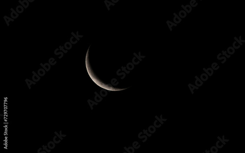 Half moon in the dark night sky. Close-up view.