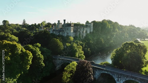 Castle near an ancient bridge over a picturesque river in 4k photo