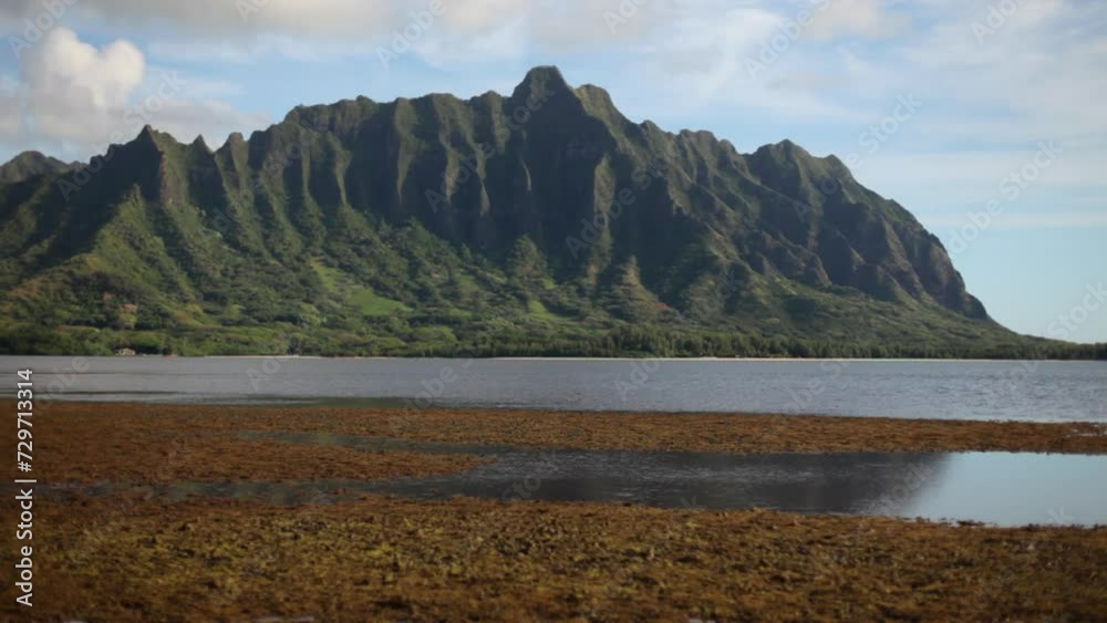 Steady ocean water with beautiful view of Hawaiian mountains Steady ocean water with beautiful view of Hawaiian mountains