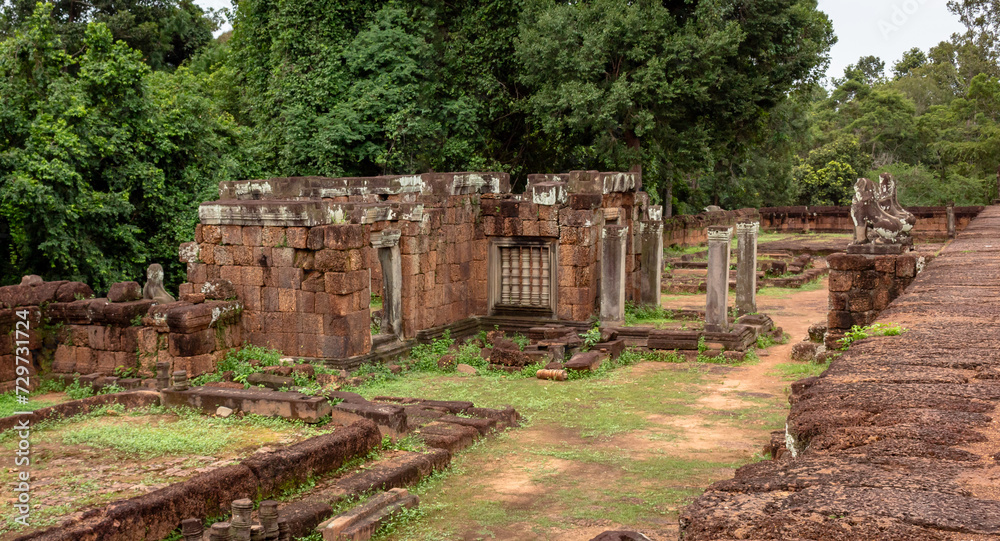 Red brick and stone temple ruin building complex structure in Pre Rup temple pagoda Angkor Wat historical park in the green forest of Siem Reap Cambodia