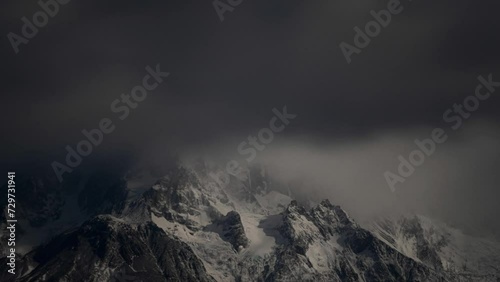 Timelapse of Foggy Peaks Mountain Cerro Paine Grande, Patagonia, Chile photo