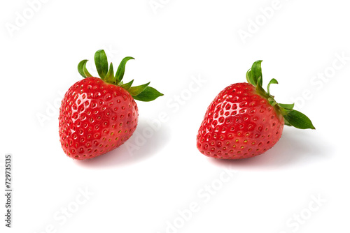  Two red strawberries on a white background