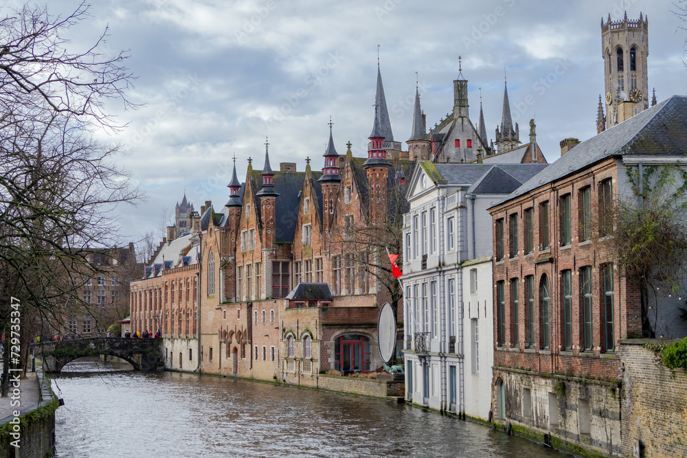 Beautiful city skyline of the village building architecture along a rozenhoedkaai Rosary Quay river canal reflection in Brugge Flanders Belgium on a cloudy day Beautiful city skyline of the village building architecture along a rozenhoedkaai Rosary Quay river canal reflection in Brugge Flanders Belgium on a cloudy day