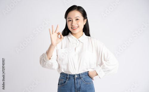 Portrait of young Asian businesswoman posing on white background