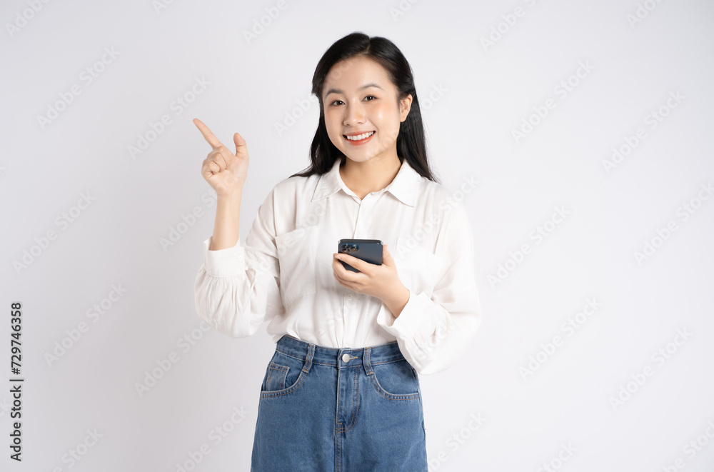 Portrait of young Asian businesswoman using phone on white background Portrait of young Asian businesswoman using phone on white background