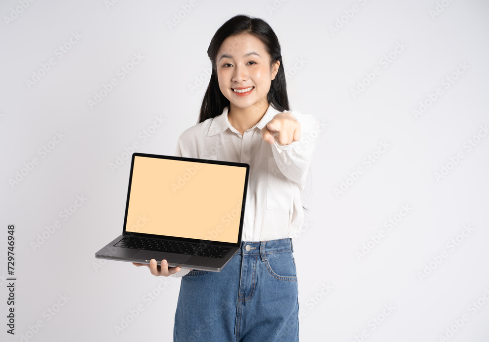 Portrait of young Asian businesswoman using laptop on white background Portrait of young Asian businesswoman using laptop on white background
