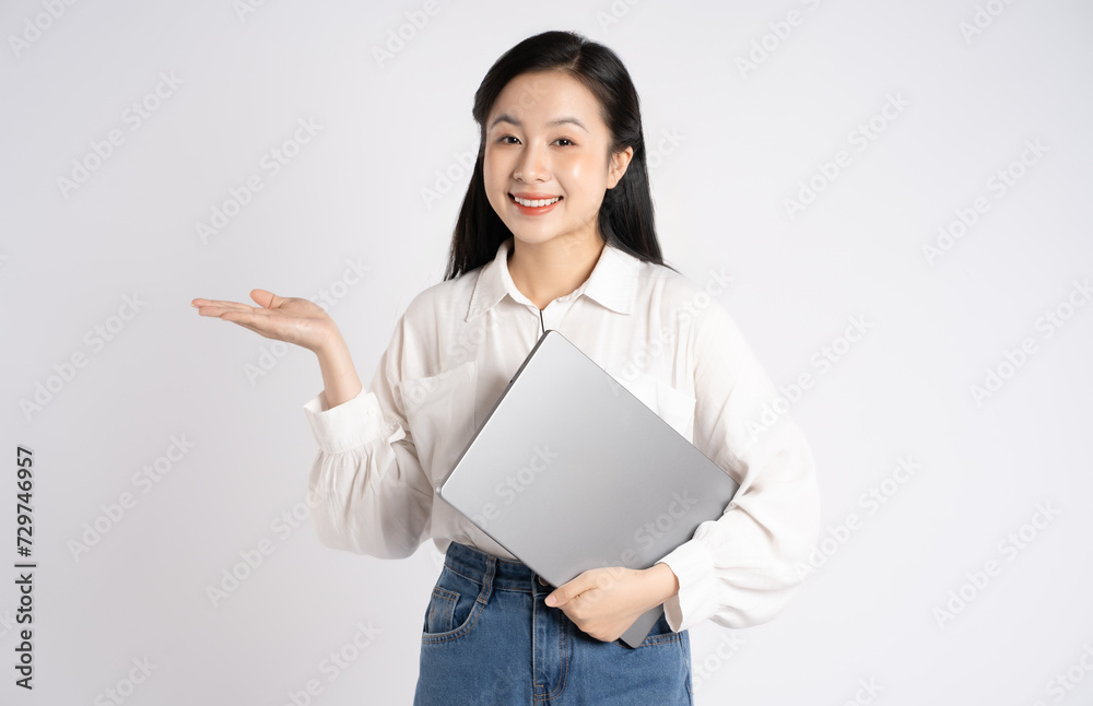 Portrait of young Asian businesswoman using laptop on white background Portrait of young Asian businesswoman using laptop on white background