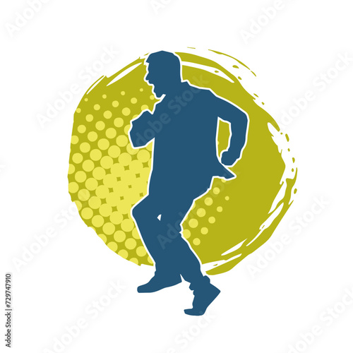 Silhouette of a slim man dancing pose. Silhouette of a male dancer in action pose.