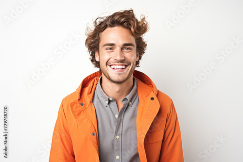 Lighthearted Laughter Dapper Man in Orange Offering a Bright Smile