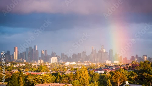 Melbourne Victoria, Australia skyline on a cloudy day with rain passing and rainbow appearing in the distance. skyscrapers foreground Jack's Magazine Maribyrnong River at Maribyrnong photo