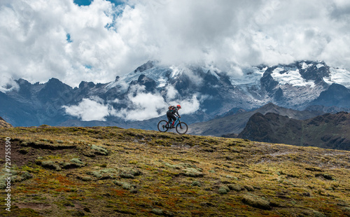 Mountain biking in the snowy mountains of Cusco Peru